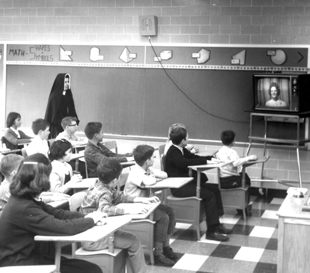 Students at St. Michael School watch television during class, under the supervision of a religious sister, circa 1960. Catholic Exponent File Photo.