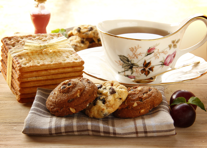 cookies and tea on brown table
