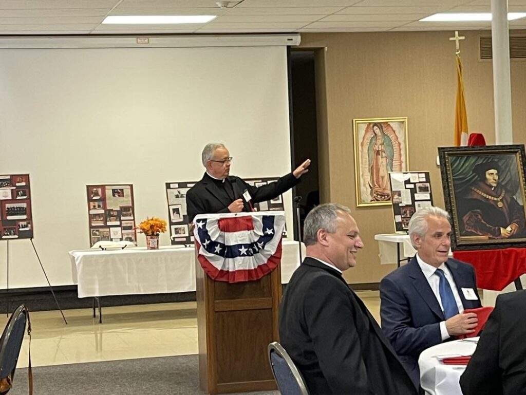 Monsignor Robert Siffrin speaks at the reception after the Red Mass