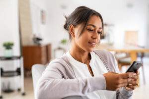 Woman scrolling on her cell phone