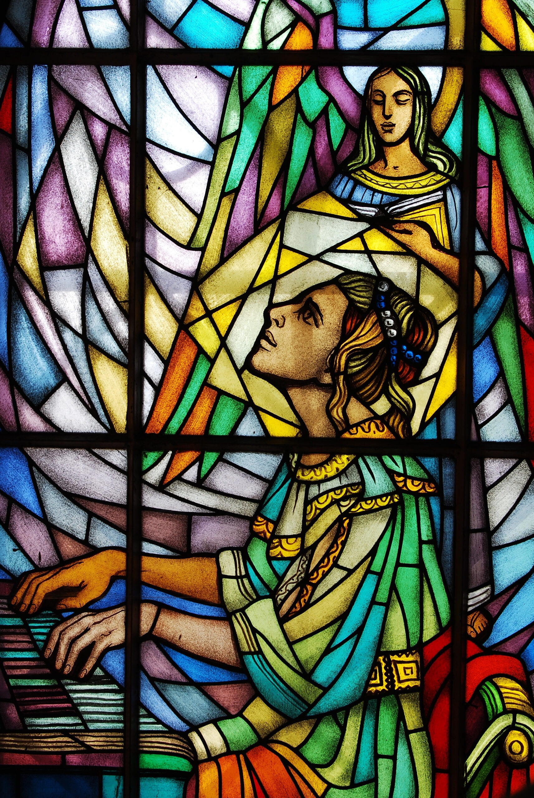 Stained glass featuring Saint Cecelia playing the organ