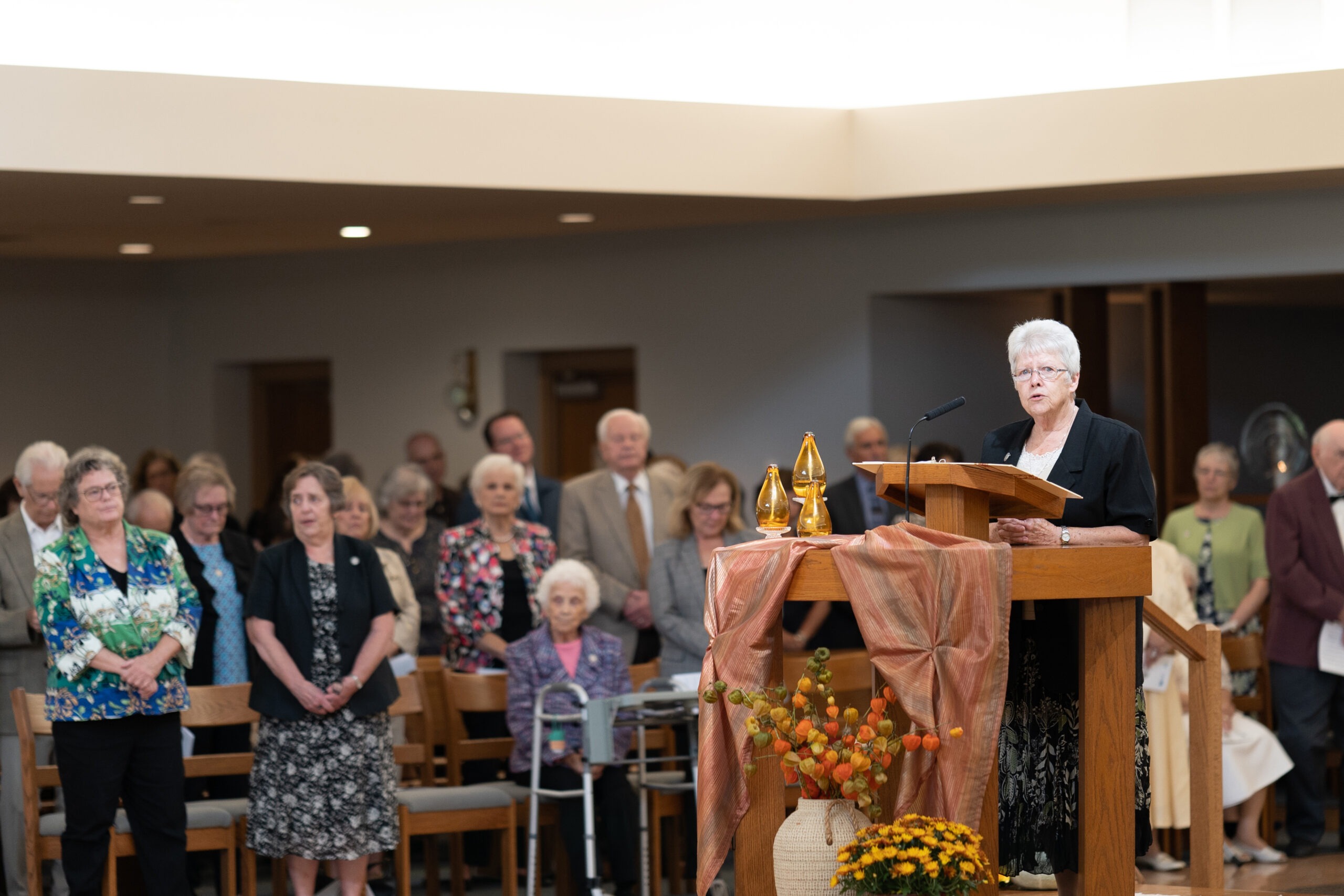 A group of Ursuline nuns stand during a reading at Mass.