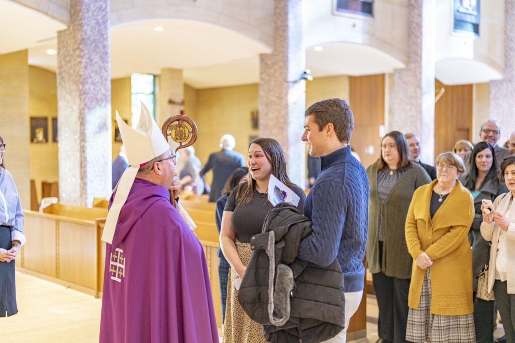 Couple chats with Bishop Bonnar after the Rite of Election. Photo by Brian Keith.