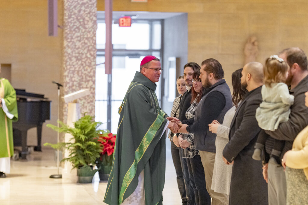 Bishop greets families who have come forward to be blessed at the annual Diocesan Mass for Life on January 14, 2024, at St. Columba Cathedral.