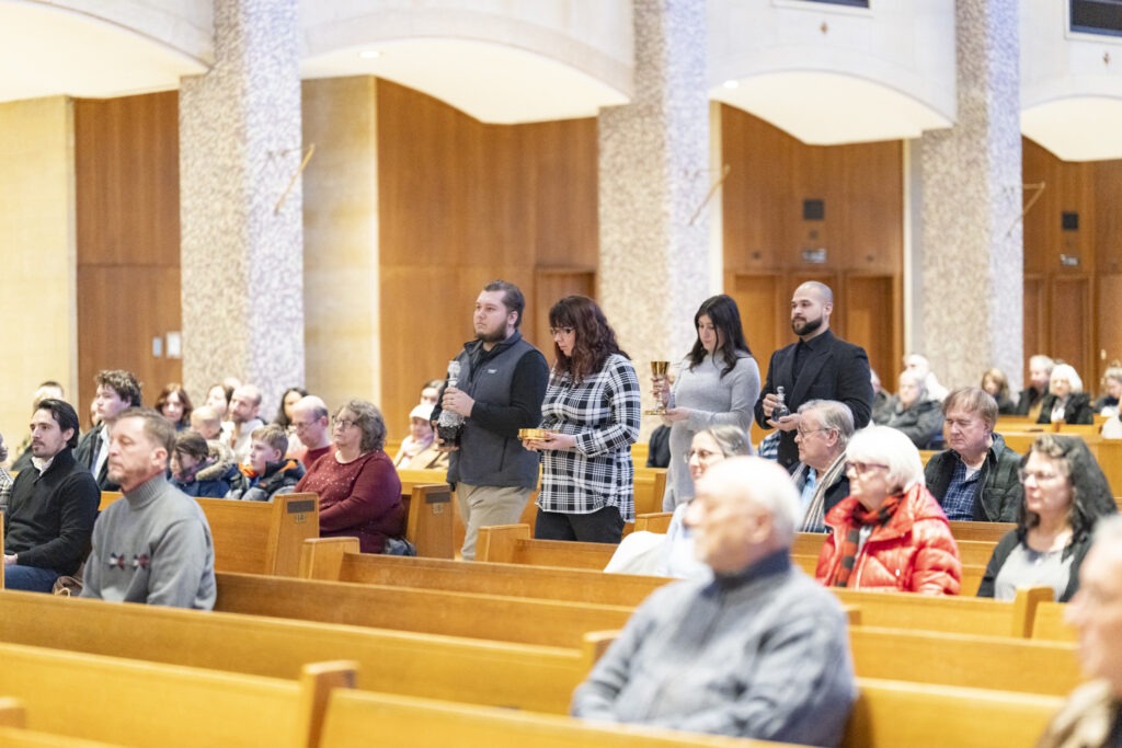 Two families bring up the gifts at the annual Diocesan Mass for Life on January 14, 2024, at St. Columba Cathedral.