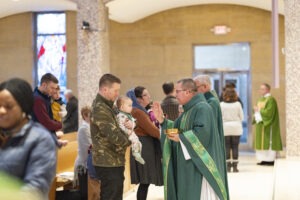 Bishop Bonnar blesses an infant at the annual Diocesan Mass for Life on January 14, 2024, at St. Columba Cathedral.