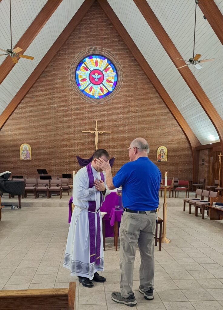 Reception of ashes at newman center in Kent on Ash Wednesday.