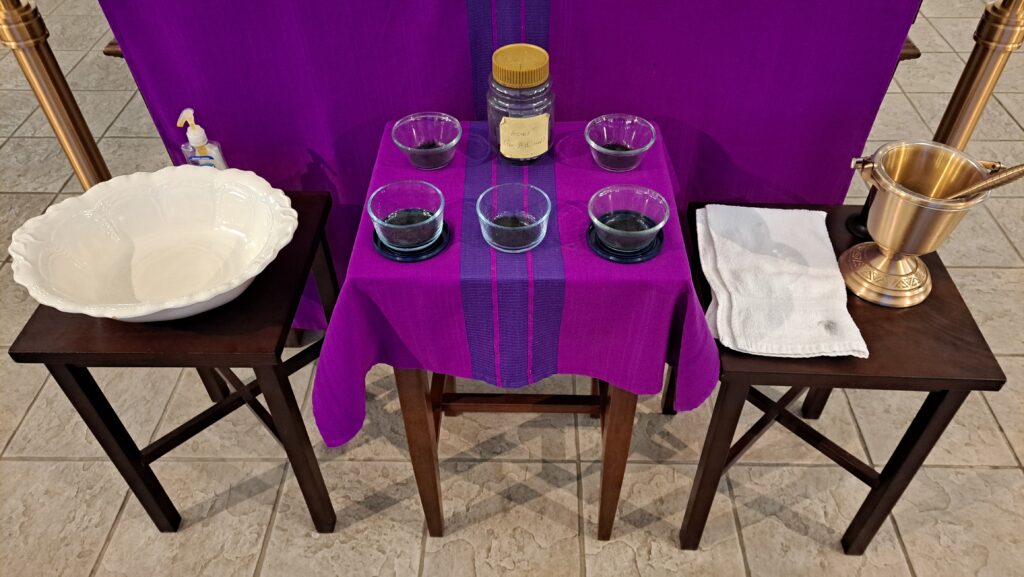 Ashes laid out on a table during Ash Wednesday at Newman Center Parish in Kent