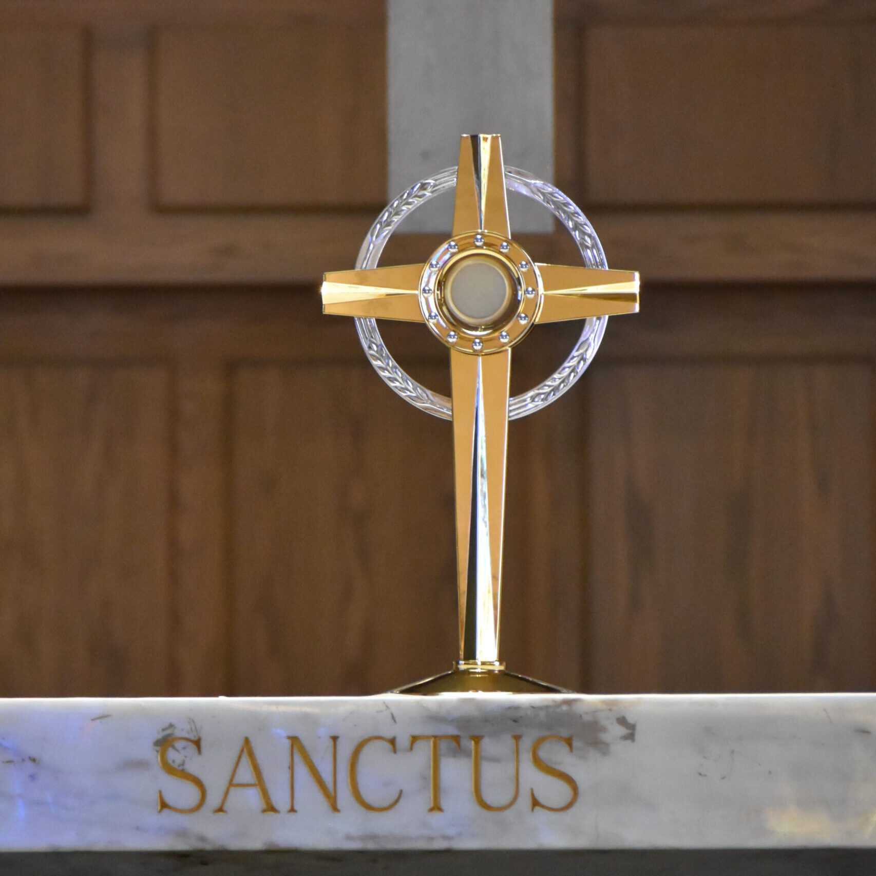 A golden monstrance sits on the altar at St. Christine Parish.
