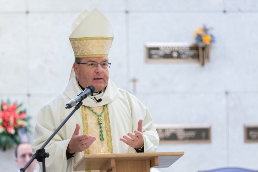 Bishop Bonnar speaks at the ambo at St. Callistus Feast Day on October 14, 2024, at Calvary Cemetery in Massillon.