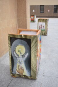 Light cover outside St. Columba Cathedral, featuring a dove.