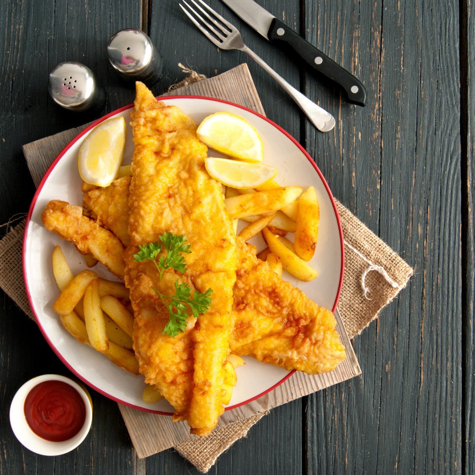 Fried fish and french fries on a plate