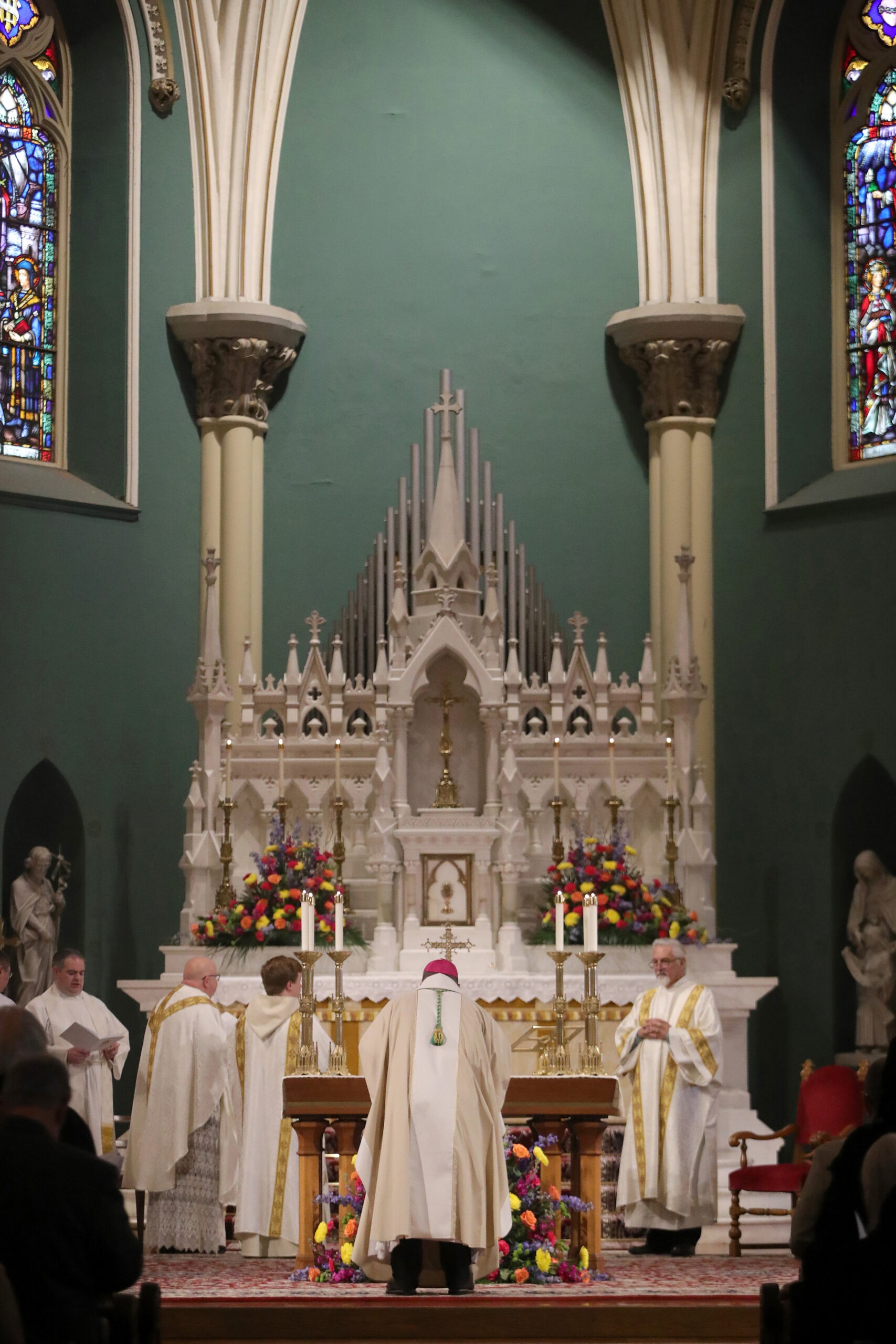 Bishop Bonnar bows in front of the altar at the basilica.
