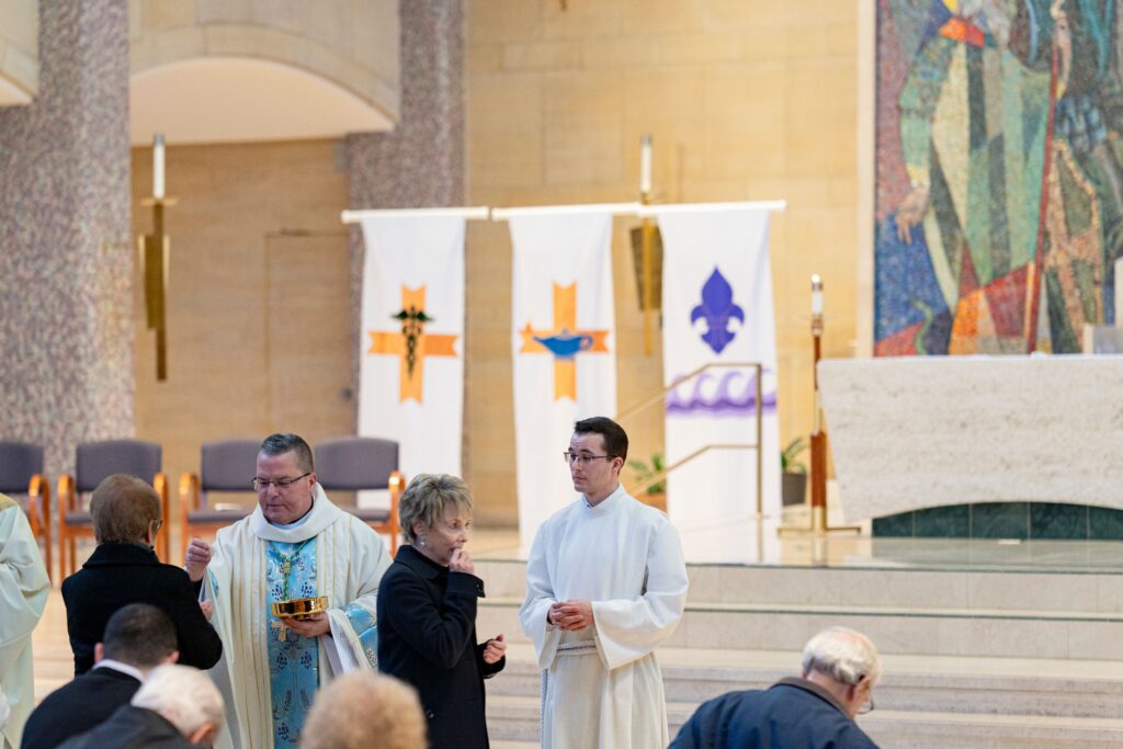 Communion at the annual White Mass. Photo by Brian Keith.