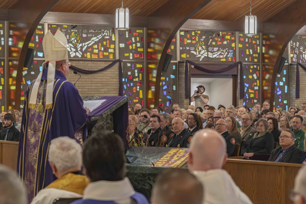 Bishop Bonnar delivers his homily at the reopening of St. Patrick Parish in Hubbard. Photo by Brian Keith.