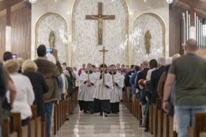 Altar servers process out at the conclusion of the St. Patrick rededication Mass. Photo by Brian Keith.