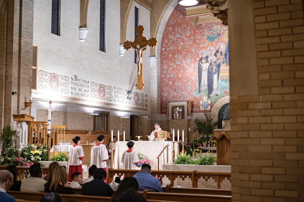 Altar servers stand at attention at the Easter Vigil 2024 at St. Dominic's. Photo by Brian Keith.