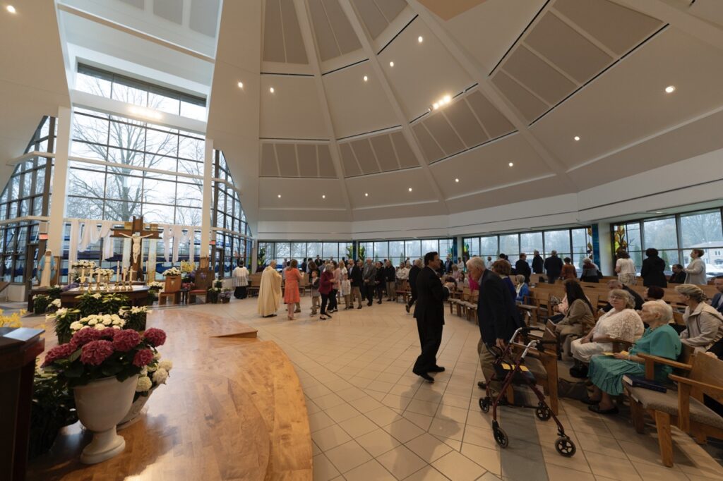 Parishioners line up for communion on Easter Sunday at Blessed Sacrament Parish in Warren. Photo by Brian Keith.