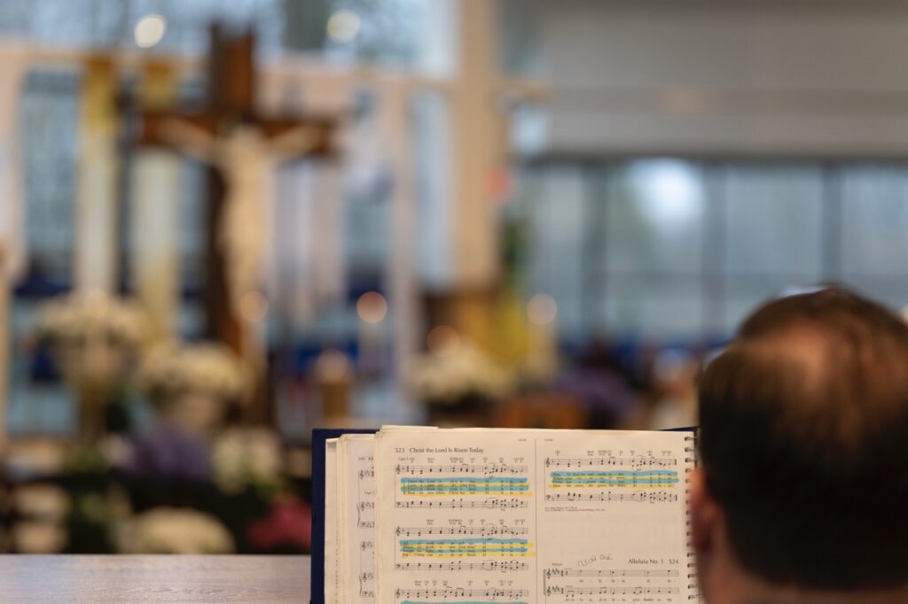 Music director plays Christ the Lord is Risen Today on Easter Sunday at Blessed Sacrament Parish in Warren. Photo by Brian Keith.