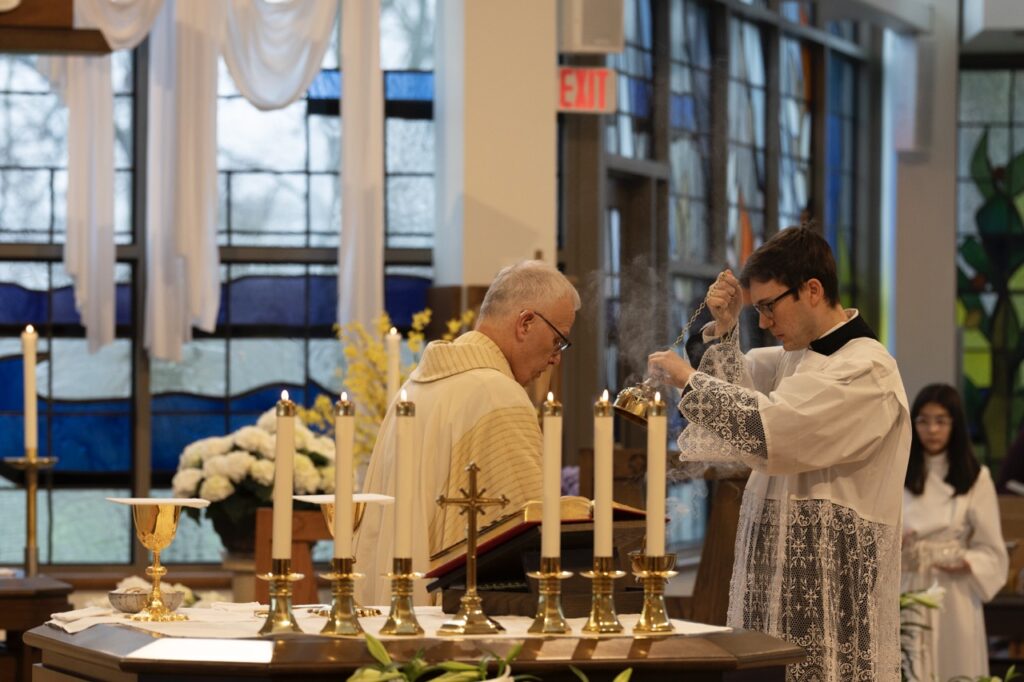 Seminarian inceses the altar on Easter Sunday at Blessed Sacrament Parish in Warren. Photo by Brian Keith.