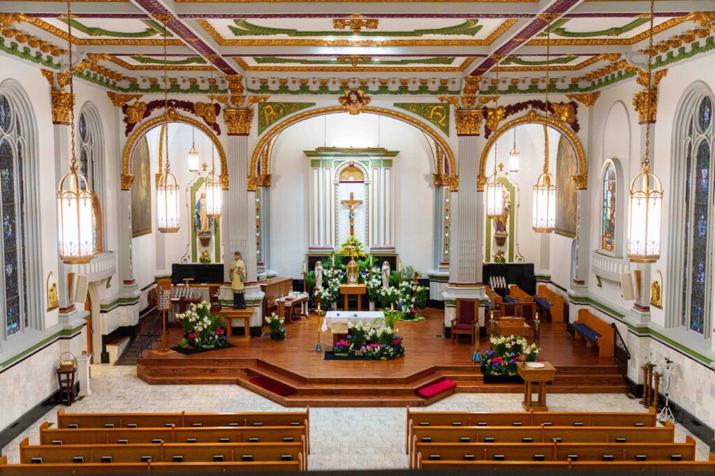 Image of the inside of the church, decorated for Easter, at Holy Trinity Parish in East Liverpool. Photo by Jimmy Joe Savage.