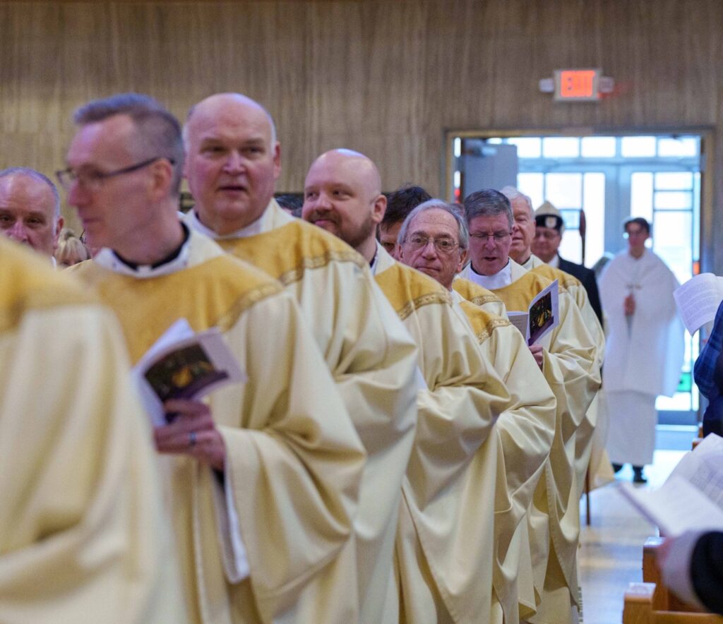 Priests walk in procession. Photo by Jimmy Joe Savage. Chrism Mass 2024.