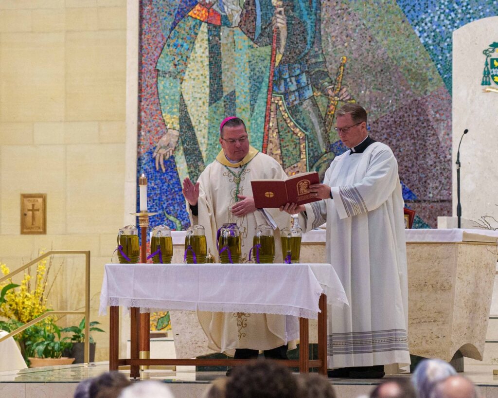 Bishop prays over holy oils. Photo by Jimmy Joe Savage. Chrism Mass 2024.