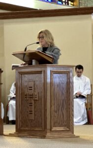 Lector does the reading during the Good Friday Liturgy 2024 at Our Lady of Peace Parish in Ashtabula. Photo by Marilou McClimans.