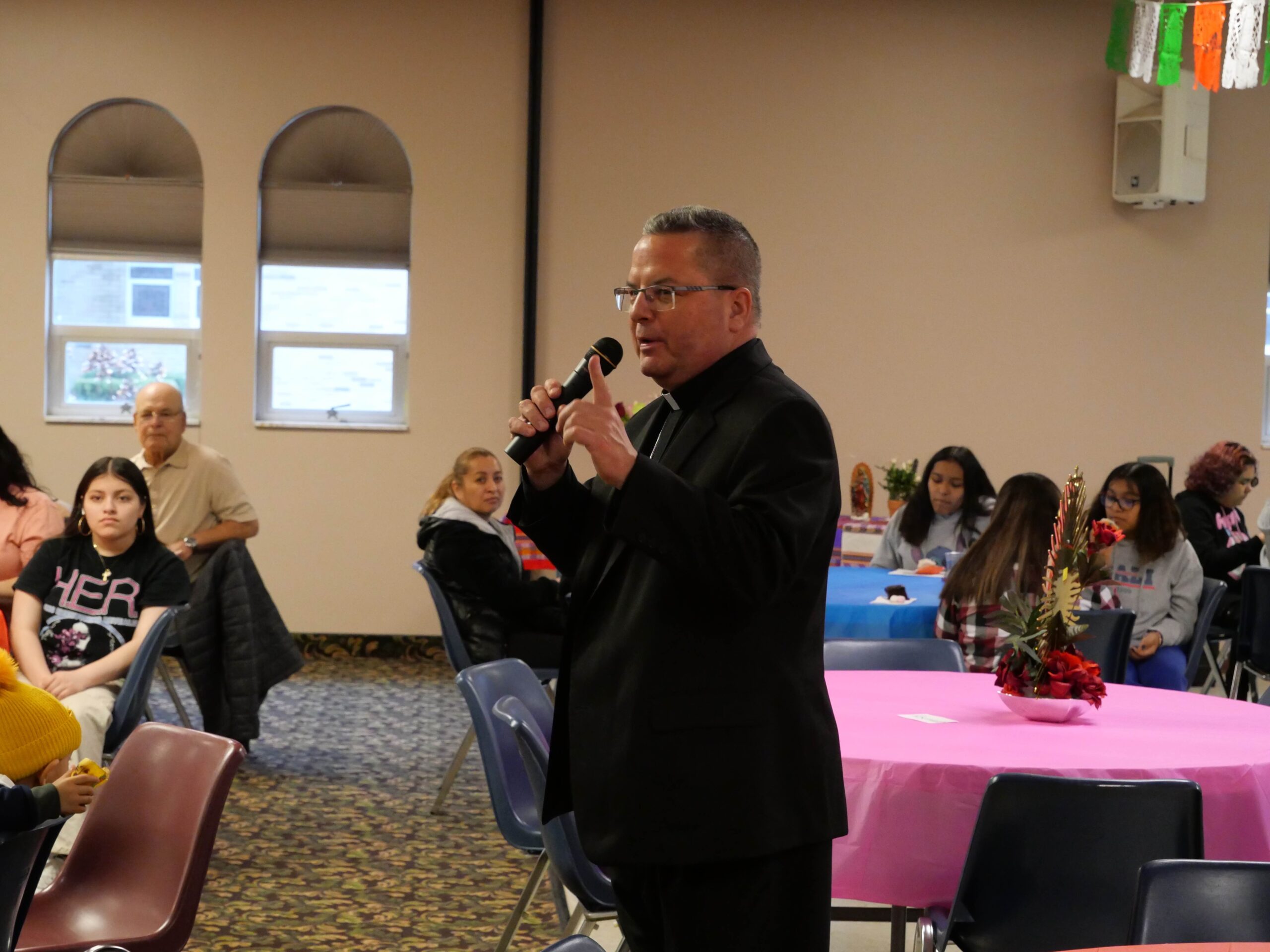 Bishop Bonnar answers questions from the hispanic community at the second annual Hispanic Summit