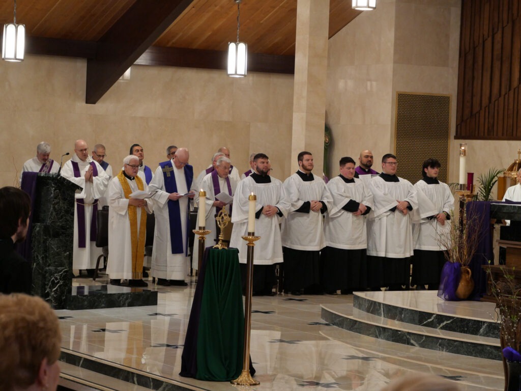 Altar servers and concelebrating priests at Mass of Blessing for the re-opening of St. Patrick Parish in Hubbard, Ohio on March 17, 2024. Photo by Michael Houy.