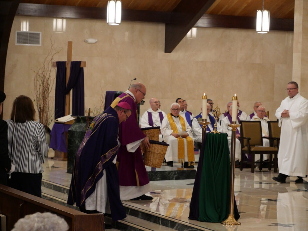 Bishop David Bonnar bows in procession for Mass of Blessing at the reopening of St. Patrick Parish, Hubbard, Ohio on March 17, 2024. Photo by Michael Houy.