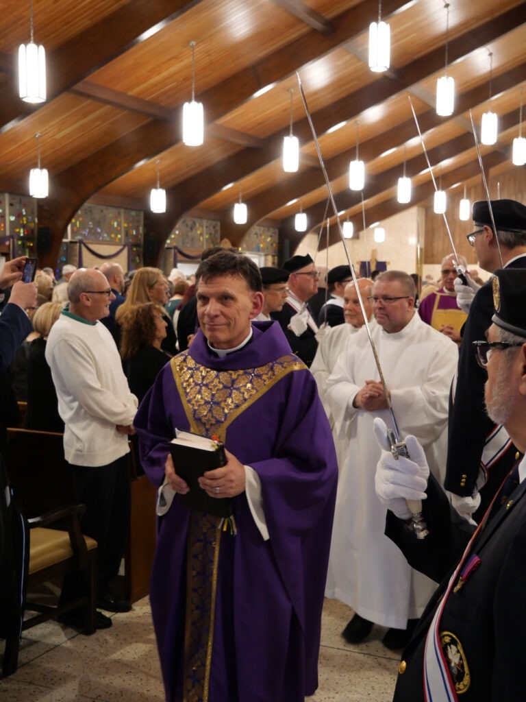 Pastor Michael Swierz in procession for Mass of Blessing at the reopening of St. Patrick Parish, Hubbard, Ohio on March 17, 2024. Photo by Michael Houy.