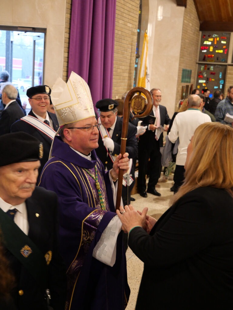 Bishop Bonnar greets parishioners after Mass of Blessing at the reopening of St. Patrick Parish, Hubbard, Ohio on March 17, 2024