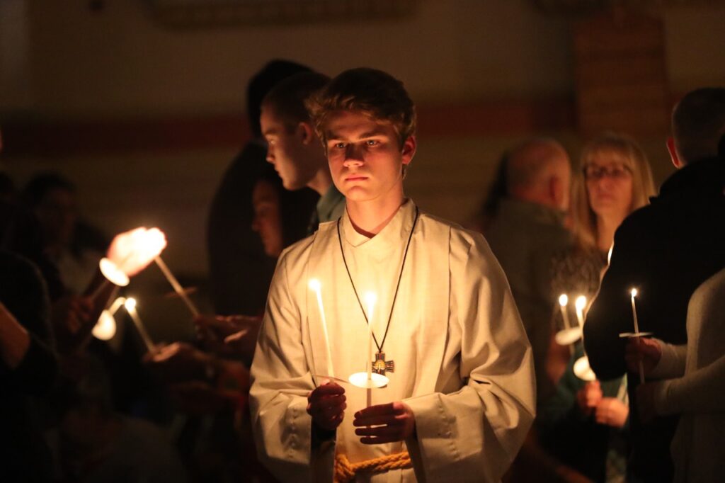 Male altar server stands at attention at St. Joseph Parish in Mogadore during the Easter Vigil 2024. Photo by Ed Hall, Jr.