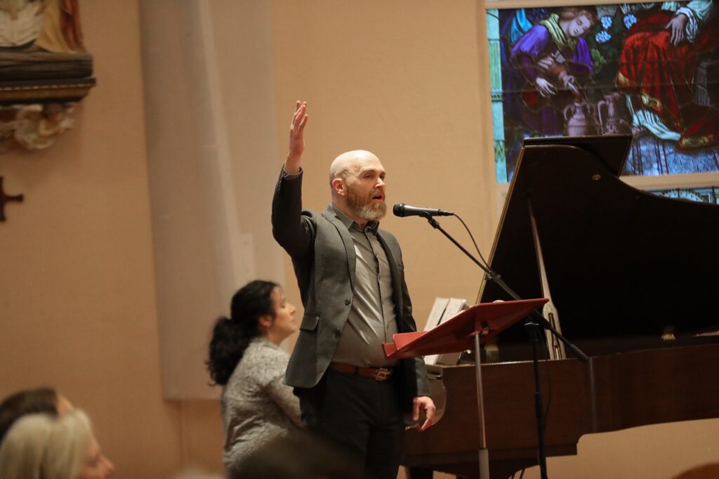 Male cantor leads the congregation in song at St. Paul Parish in North Canton on Good Friday 2024. Photo by Ed Hall, Jr.
