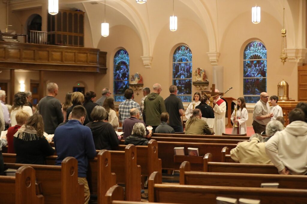 Congregants line up to venerate the cross at St. Paul Parish in North Canton on Good Friday 2024. Photo by Ed Hall, Jr.
