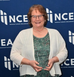 Mary poses with her award.