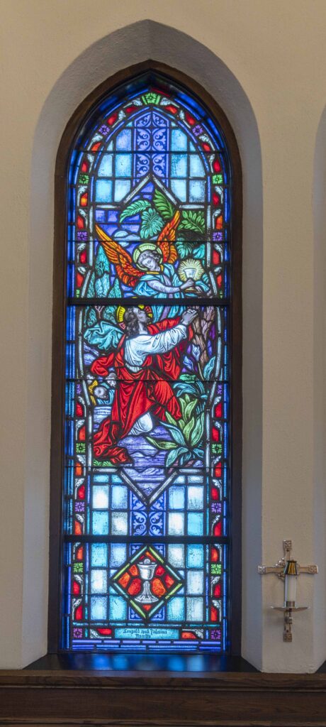 Stained-glass window of Jesus pleading with an angel in a garden. Located at Immaculate Conception Parish in Ravenna. Photo by Brian Keith.