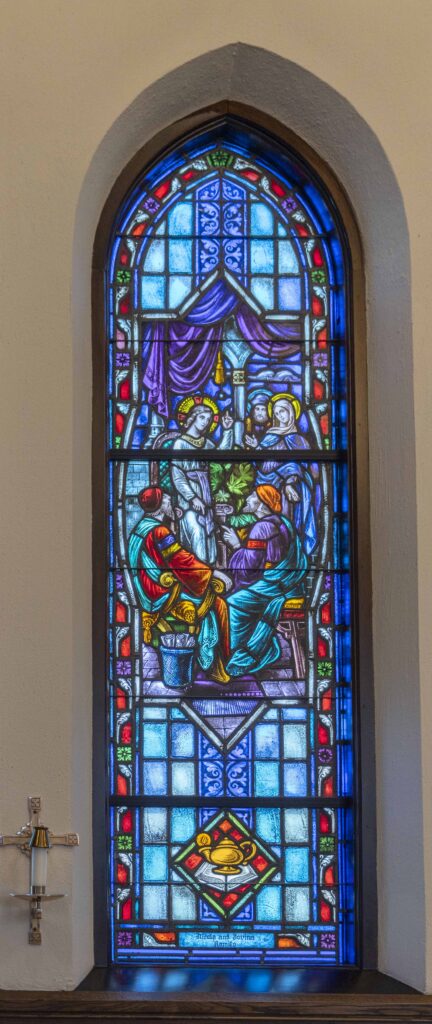 In this stained glass window, Jesus preaches to onlookers. Located at Immaculate Conception Parish in Ravenna. Photo by Brian Keith.