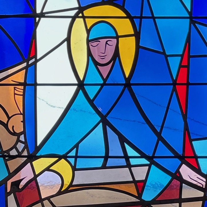 modern stained glass window, primarily blue