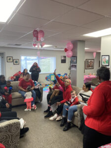 Image of women and children in a classroom setting, provided by Mercy Health