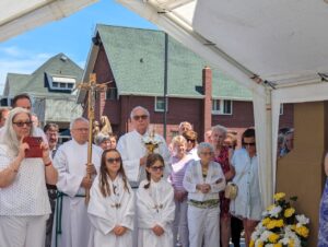 Altar servers stand at attention during the ribbon cutting of the new parish center at Mt. Carmel in Niles. Photo by Karen S. Kastner.