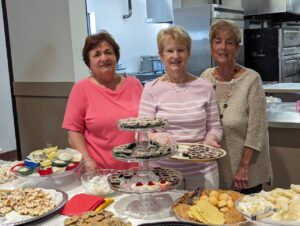 Bakers show off their cookies at the new parish center at Mt. Carmel in Niles. Photo by Karen S. Kastner.