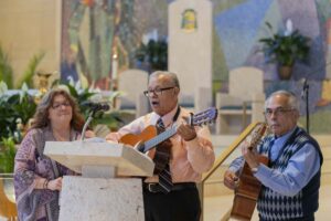 A trio plays guitar at the Cursillo Mass at St. Columba Cathedral. Photo by Brian Keith.