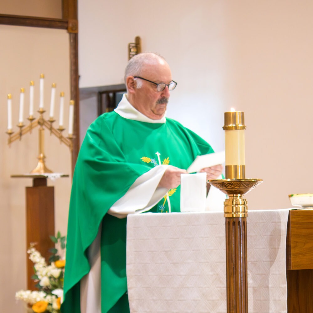 Father rogers delivers the homily at his retirement Mass