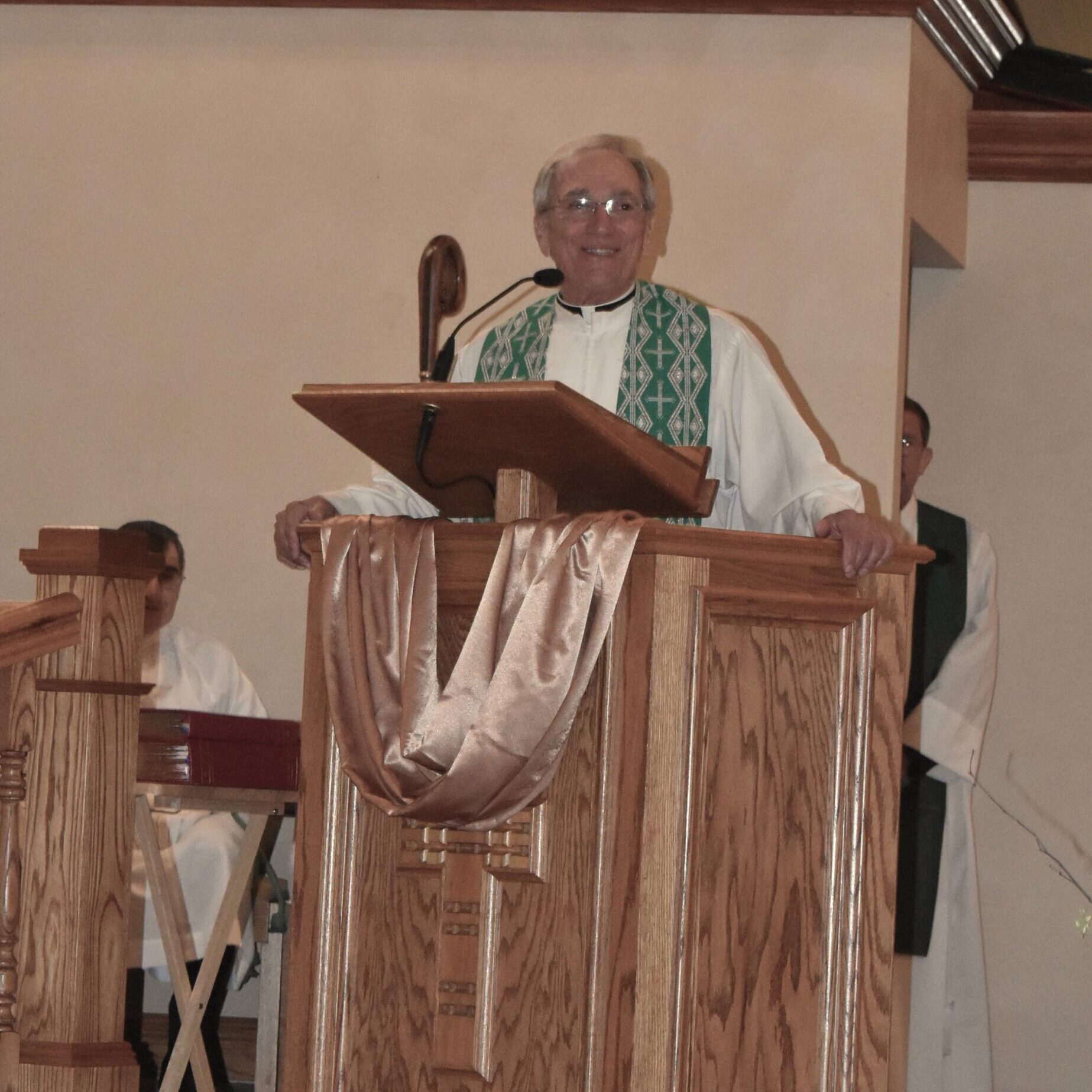 Father Thomas delivers a homily at his retirement Mass