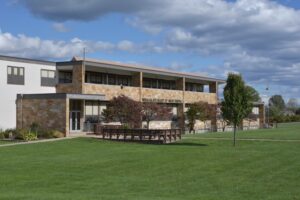 Image of the outside of the modern church building in Austintown