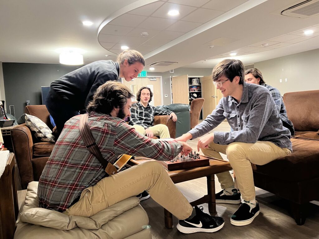 Seminarians around a table, playing board games