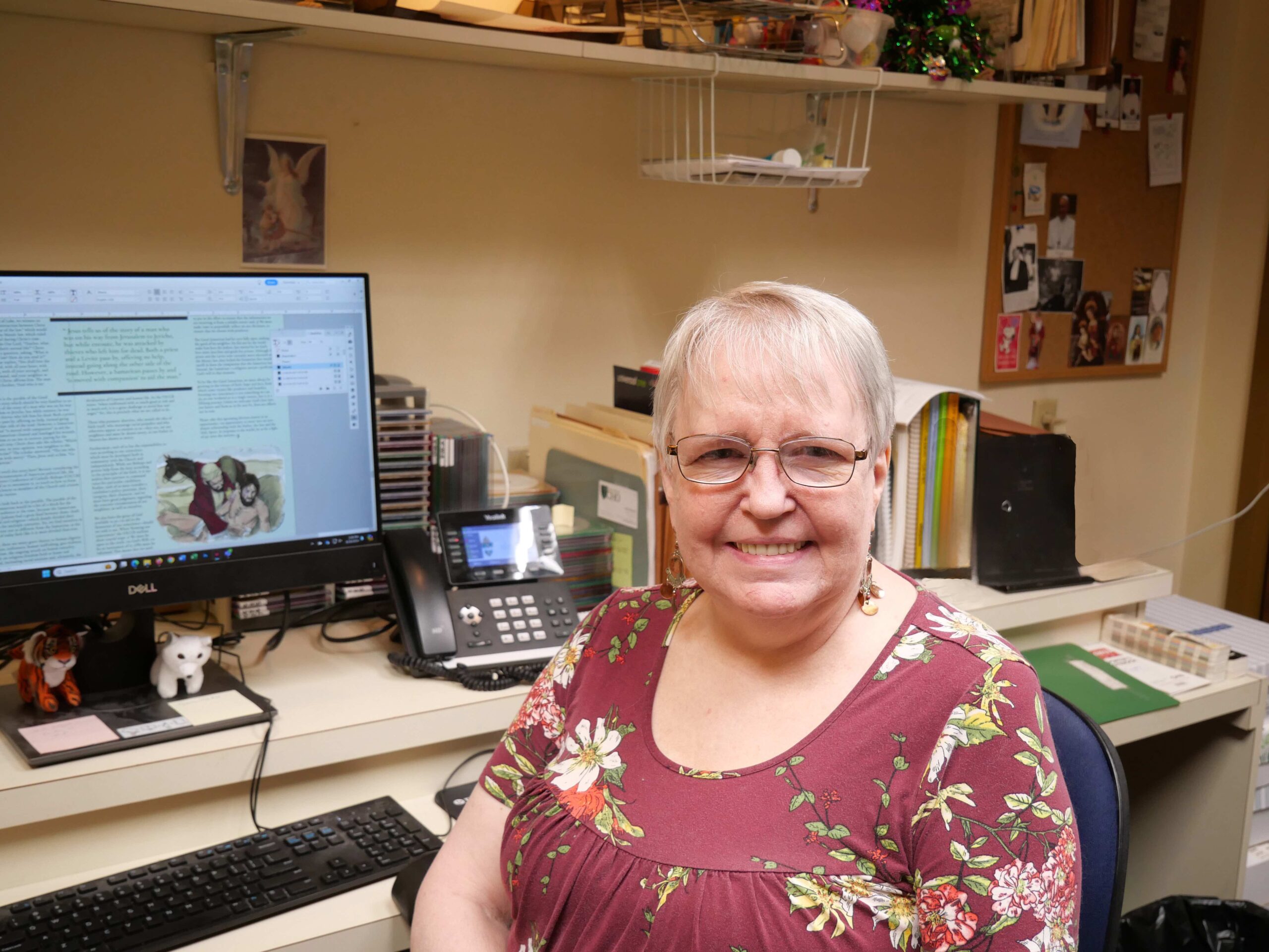 Image of Netta Sweetko, seated by her computer in the Echo offices