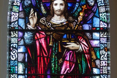 Stained glass window depicting Christ the King